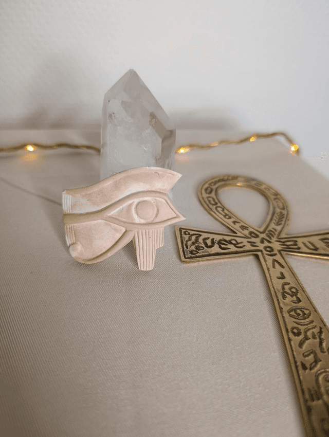 Amulette Oeil d&#039;Horus (Oudjat) blanc/saumon